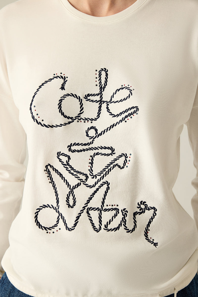 Klares, feminines Rundhalsshirt mit Glitzersteinen.