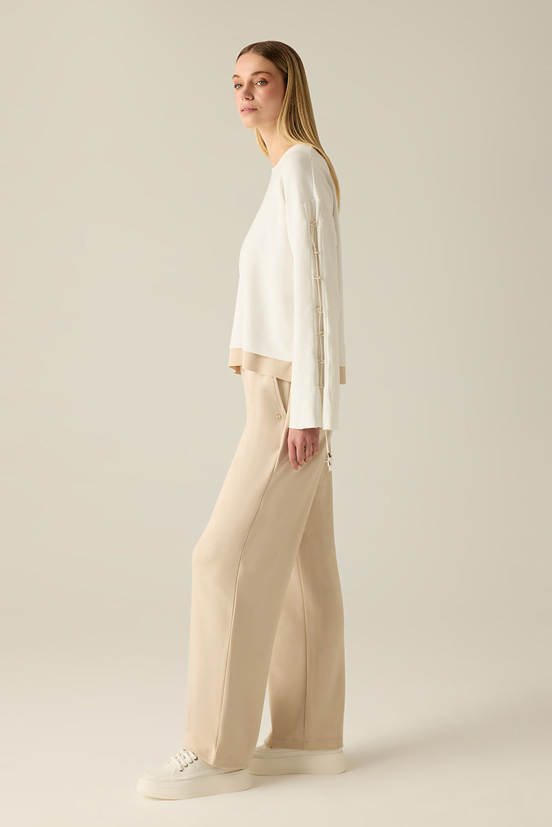 Sweatshirt with sleeve lacing.