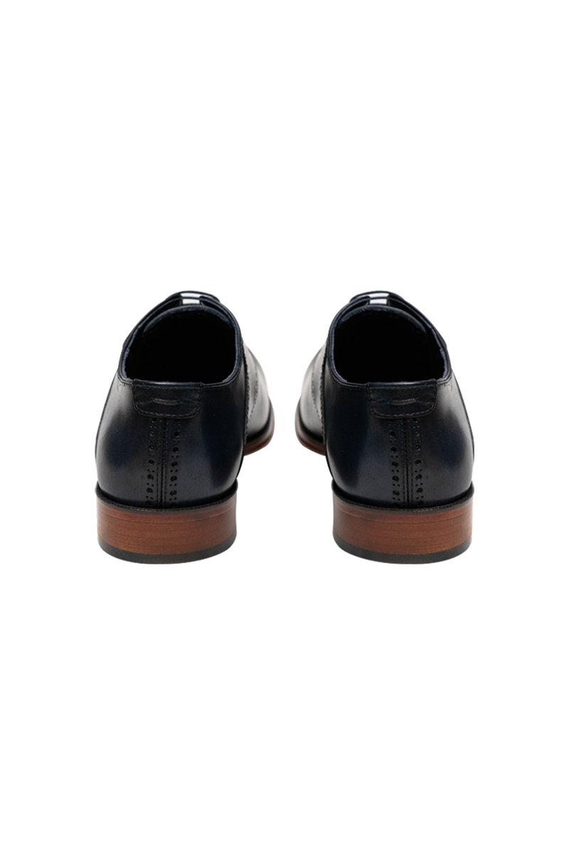 Eleganter Derby-Brogue mit Lyra-Lochung, Rahmennaht und Lederlaufsohle.