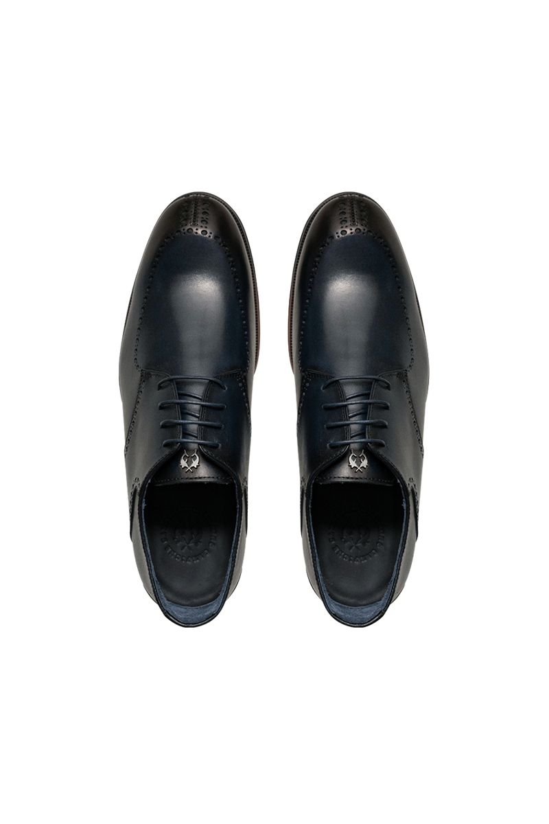 Eleganter Derby-Brogue mit Lyra-Lochung, Rahmennaht und Lederlaufsohle.