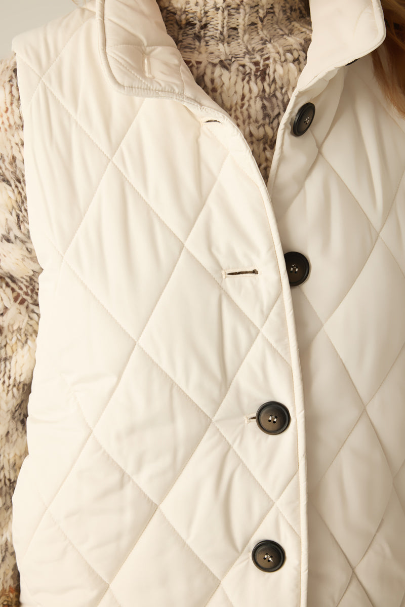 Women's quilted vest with buttons in cream