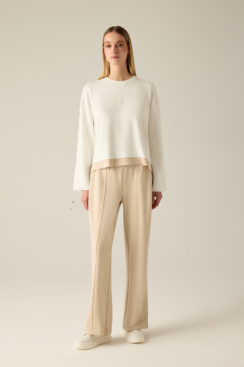 Sweatshirt with sleeve lacing.