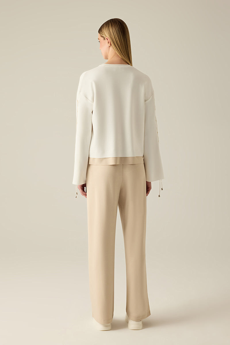 Sweatshirt with sleeve lacing.