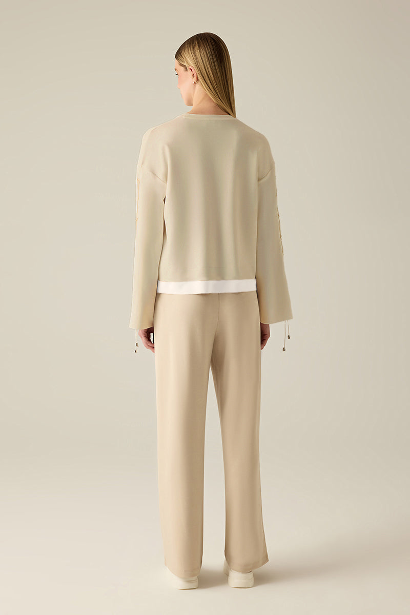 Sweatshirt with sleeve lacing.