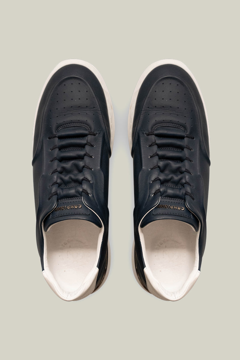 Leather sneakers with concealed lacing.
