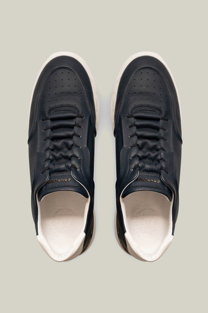 Leather sneakers with concealed lacing.