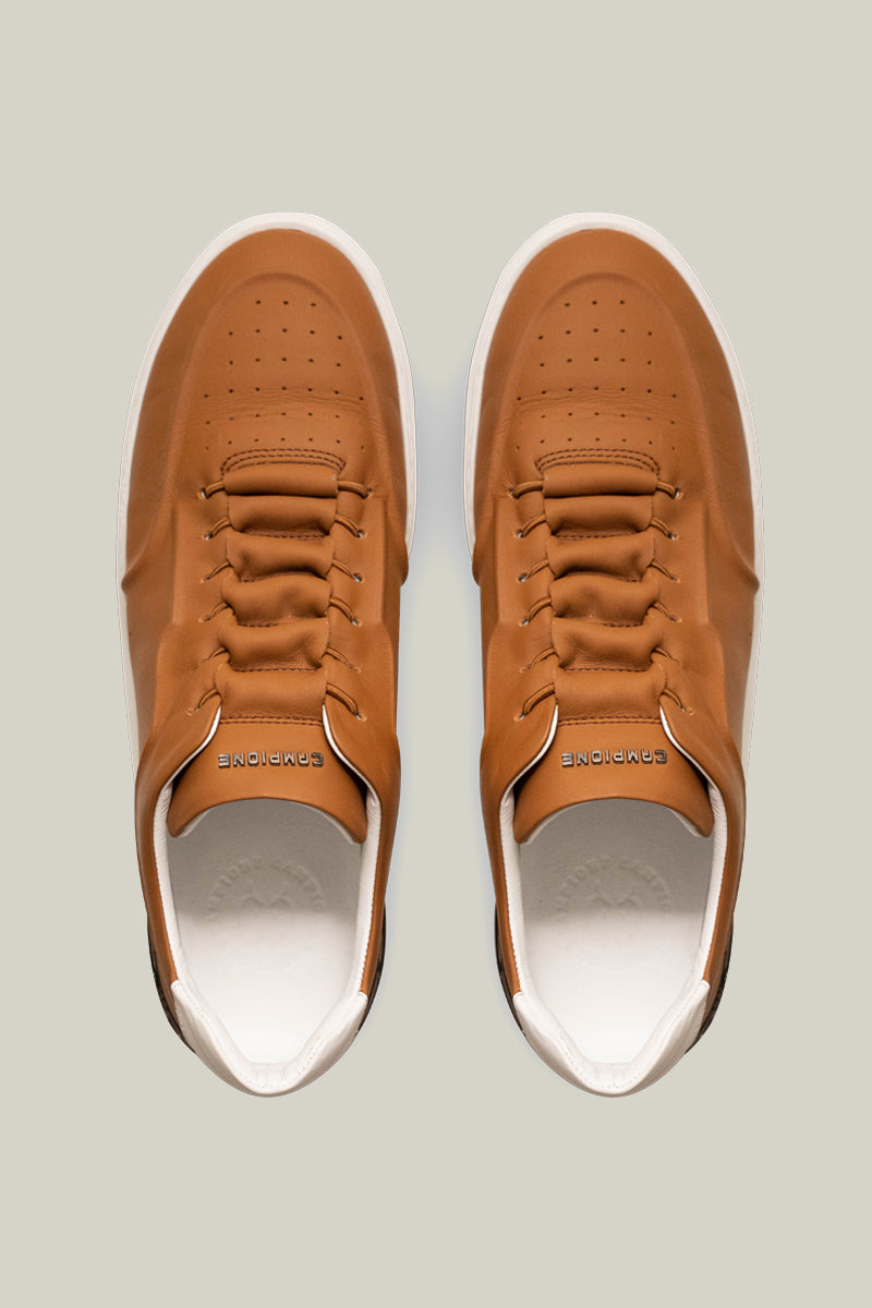 Leather sneakers with concealed lacing.