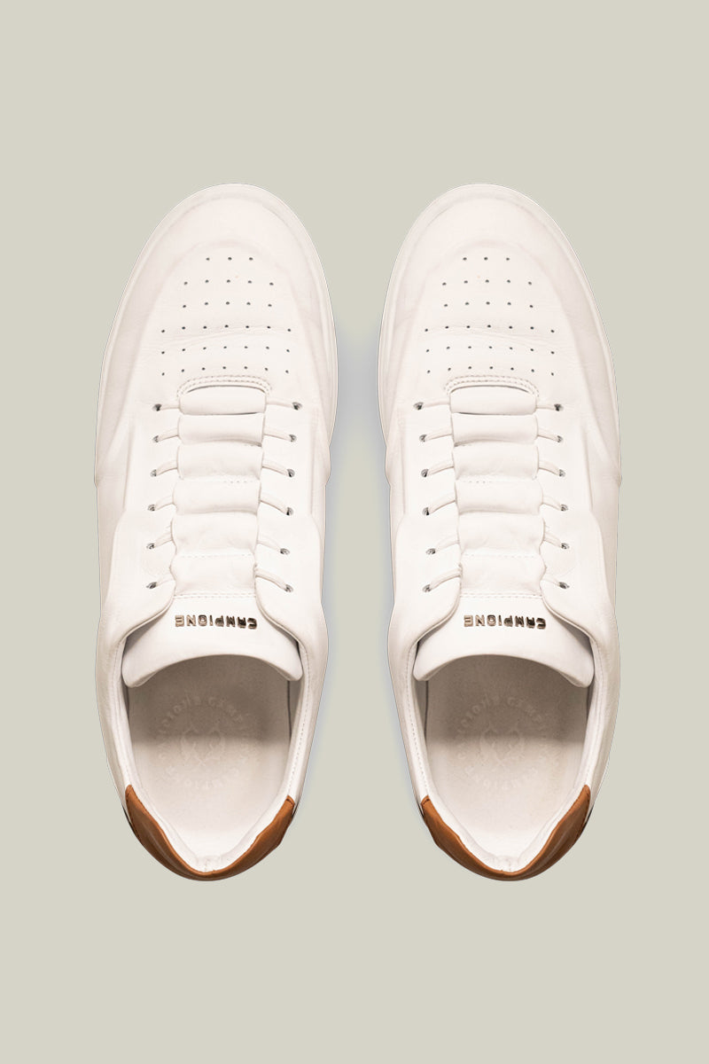 Leather sneakers with concealed lacing.