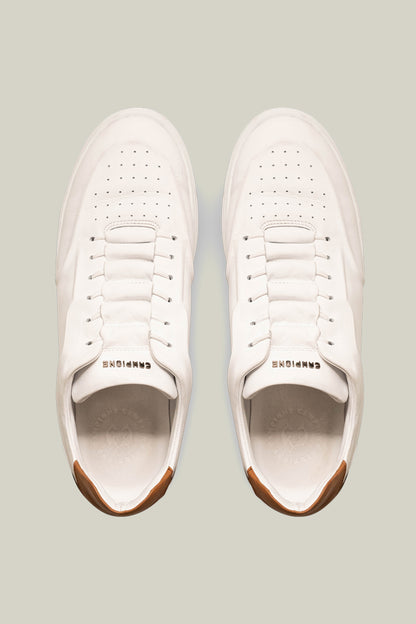 Leather sneakers with concealed lacing.