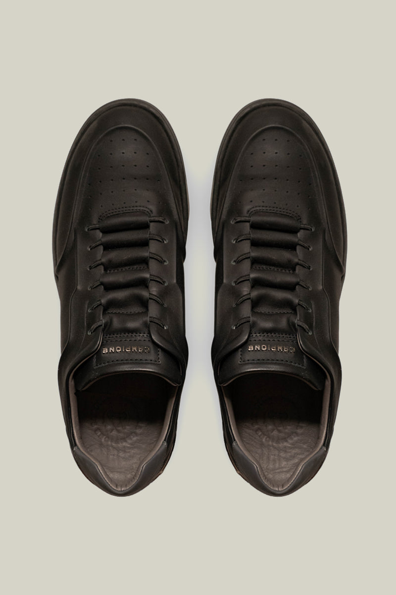 Leather sneakers with concealed lacing.