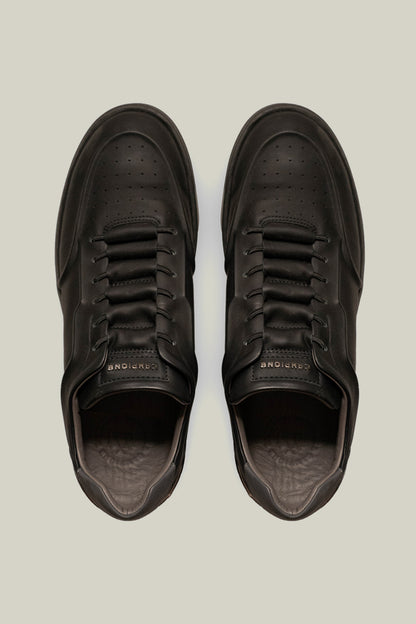 Leather sneakers with concealed lacing.