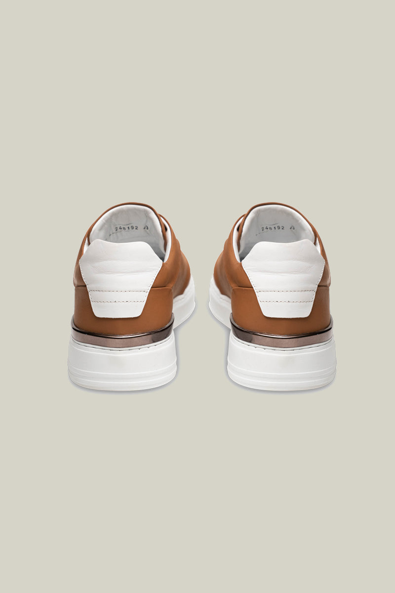 Leather sneakers with concealed lacing.
